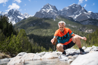 René Fritschi discovers a piece of metal in the stream bed in Val S-charl.