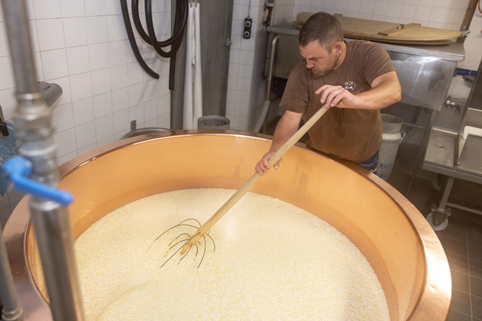 Marcel stirring the raw milk.